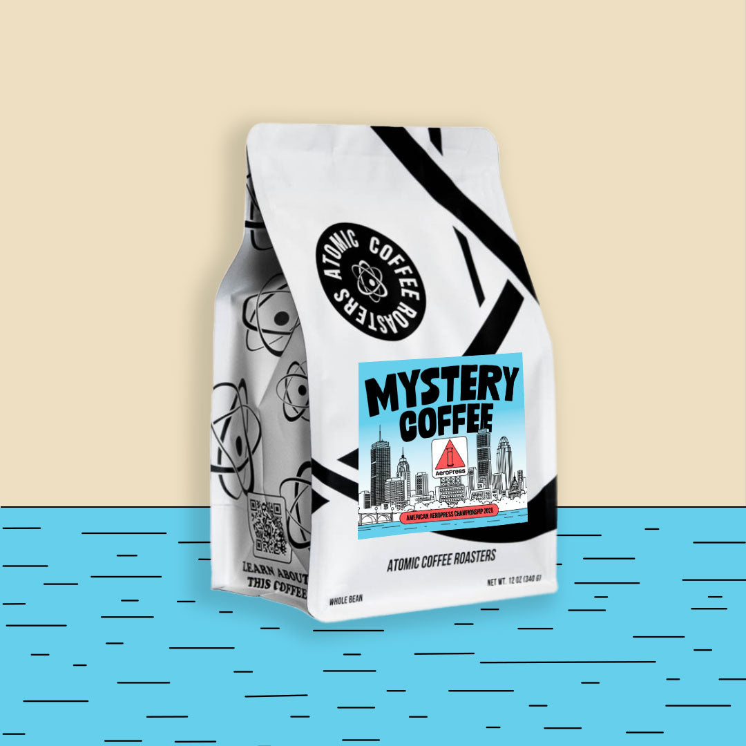 Mystery Coffee bag on tan and blue background